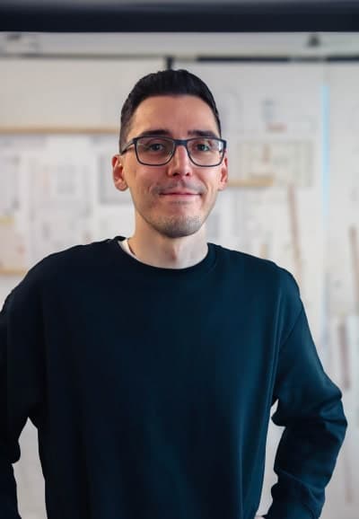 Portrait of Istvan smiling into the camera.